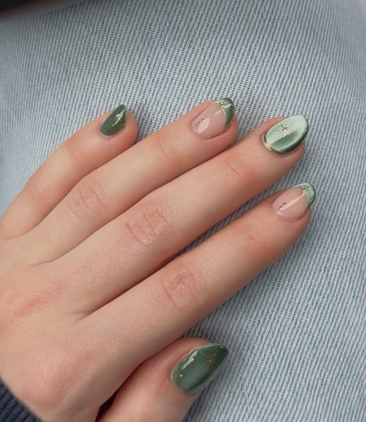 Sage green marbled almond nails